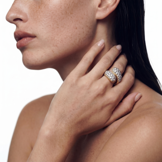 yellow gold rings featuring brilliant cut diamonds and hard stones worn