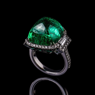 Gold ring with sugar loaf cut emerald and diamonds