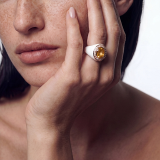 gold and white enamel ring whit heliodorus and diamonds worn