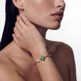 Gold Bracelets with hard stones and diamonds worn