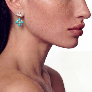 Gold earring with Arizona turquoises and diamonds worn
