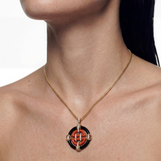 Gold Necklace with black and coral enemal and diamonds worn
