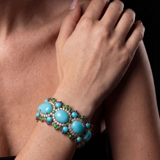 Gold bracelet with Arizona turquoise, sapphires, diamonds worn