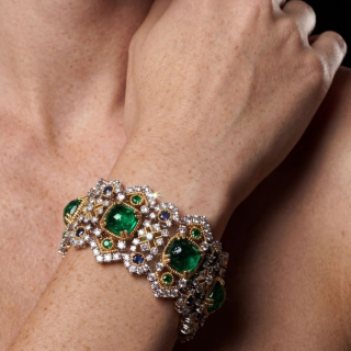 Gold Bracelet with emeralds, sapphires and diamonds worn