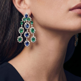 Gold Earring with emeralds, sapphires, pavé diamonds worn