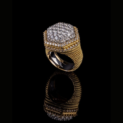 gold ring featuring a hexagonal design with pavé diamonds
