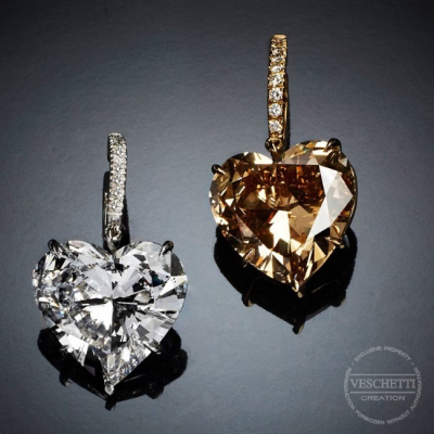 Regina Di Cuori, Magnificent white and Fancy Orange heart-shaped diamond earrings